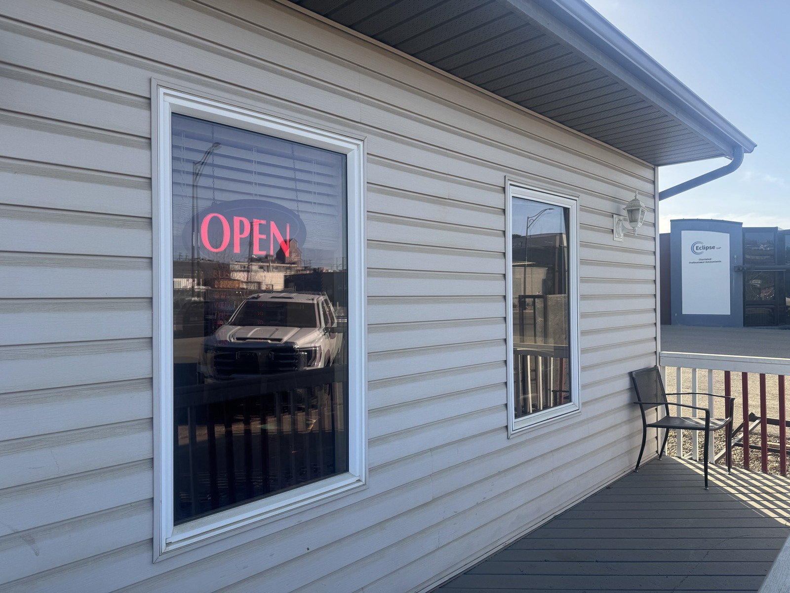 Dawson Creek Barbershop exterior with OPEN sign