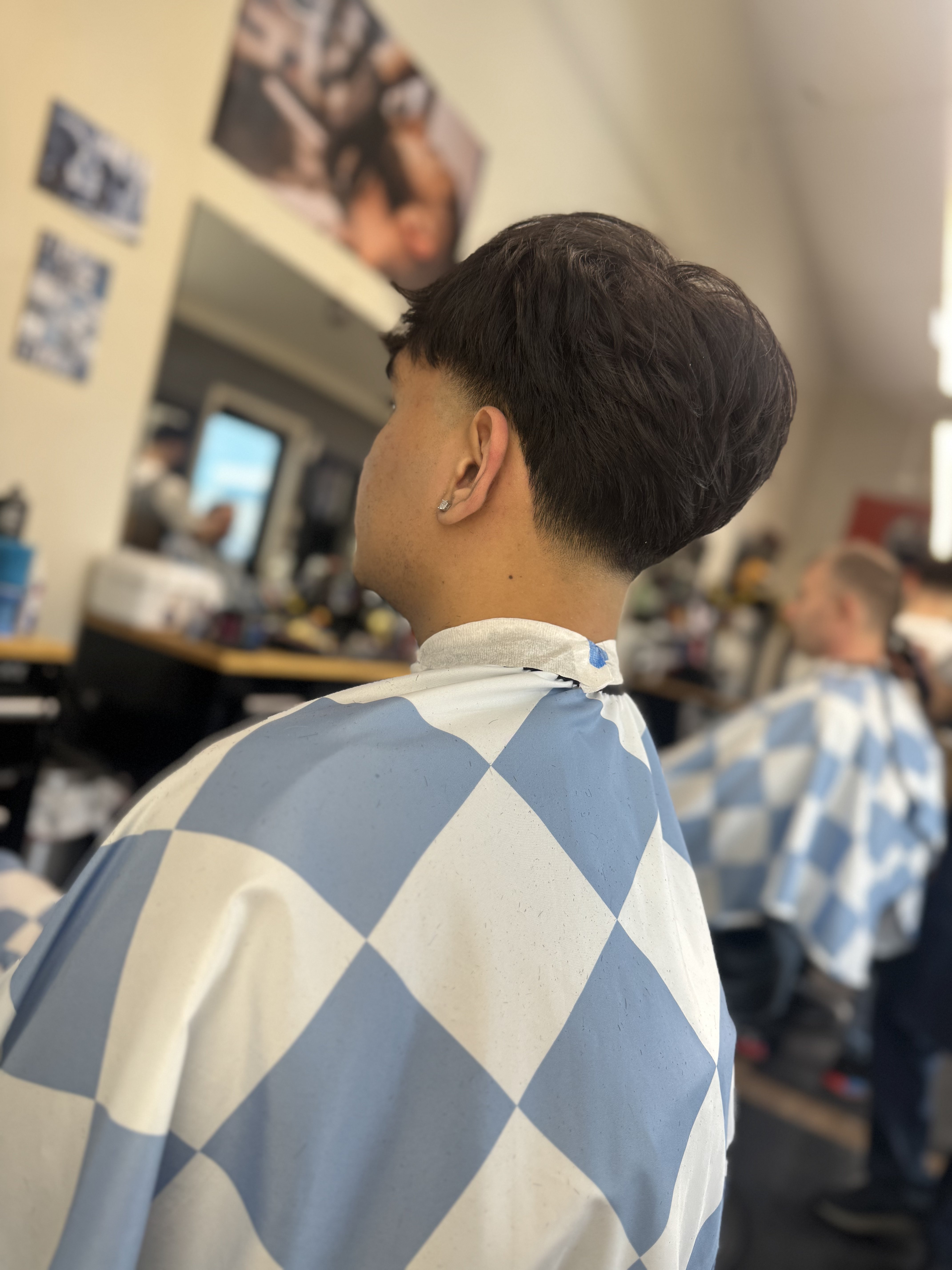 Taper fade — back view at Dawson Creek Barbershop