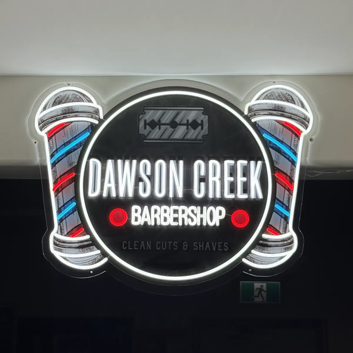 Clean Cuts and Shaves neon sign inside Dawson Creek Barbershop