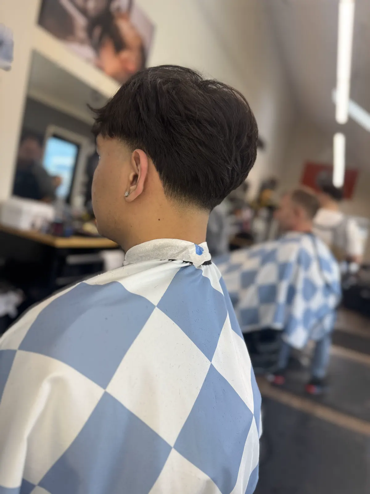 Back view of a textured fade at Dawson Creek Barbershop